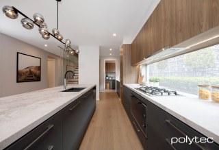 Polytec - Lower cabinets in Cinder Matt, Upper cabinets in Notaio Walnut Ravine.