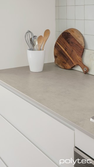 Polytec - Doors in Blossom White Matt, Benchtop in Grey Cement Smooth.