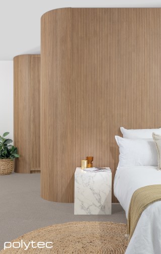 Polytec - Wall lining in Batten Oak Woodmatt, Wardrobe doors and Batten Oak Woodmatt, Bedside table in Marmo di Monte Smooth.