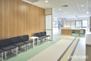 Polytec - Wall and counter panels in Natural Oak Matt, Laminate benchtop in Classic White Matt.